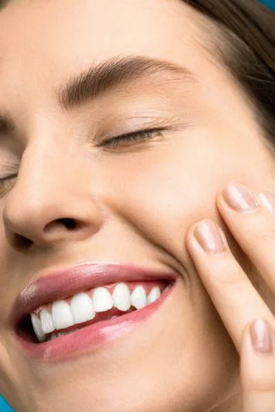 woman enjoying the results of her facial esthetics treatment from Serenity Dental in Spokane Valley, WA
