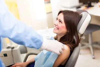 woman smiling during her dental appointment at Serenity Dental in Spokane Valley, WA