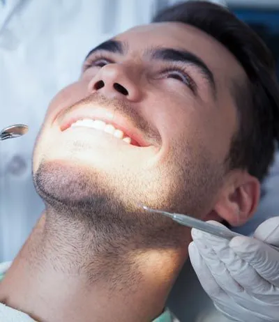 man getting same-day dental crowns from Serenity Dental in Spokane Valley, WA