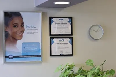 dental certifications and advertisements on the wall of Serenity Dental in Spokane, WA
