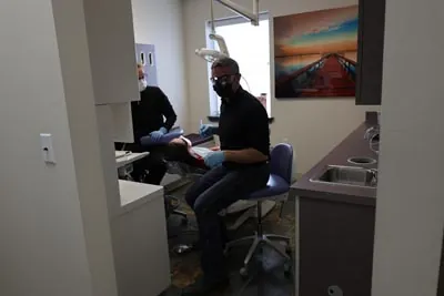 Dr. Welton providing emergency dental care for a patient in Spokane, WA
