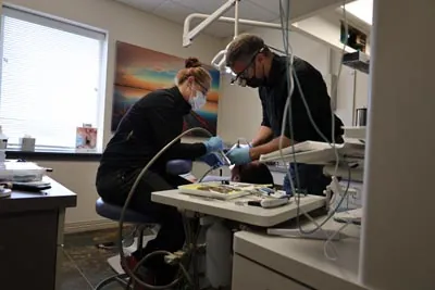 Dr. Welton providing dental services for a patient at Serenity Dental in Spokane, WA