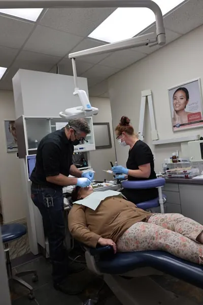 Dr. Welton administering a dental filling to restore a patient's smile at Serenity Dental in Spokane, WA
